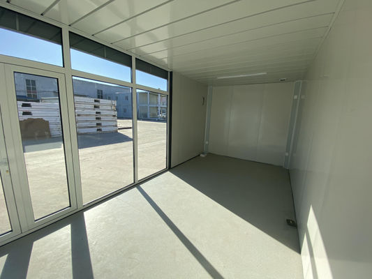 Ασφαλές και ανθεκτικό flat pack container house με ηλεκτρικό ρεύμα και γρήγορο χρόνο εγκατάστασης